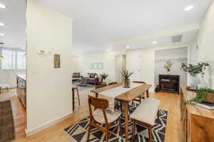 Dining area featuring recessed lighting and light wood finished floors