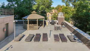 View of patio with a gazebo and grilling area