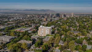 Aerial overview of property's location with property parcel outlined and a mountainous background