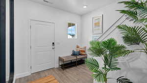 Entryway featuring light wood-style floors and baseboards