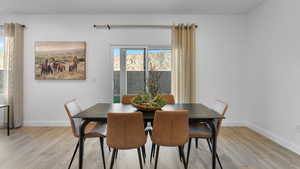 Dining room featuring light wood-style floors