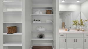 Full bathroom featuring vanity and wood finished floors