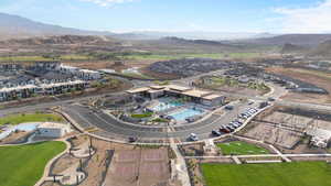 View of property location featuring mountains and nearby suburban area