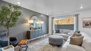 Living area featuring wood finished floors and recessed lighting