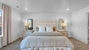 Bedroom with carpet floors and recessed lighting