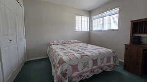 Bedroom featuring a closet and carpet floors