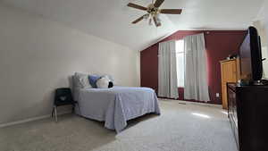 Primary Bedroom with light colored carpet, vaulted ceiling, and ceiling fan