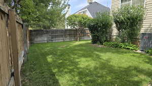 View of fenced backyard