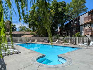 Community pool with a patio