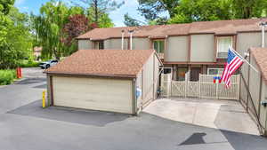 View of front of home with roof with shingles