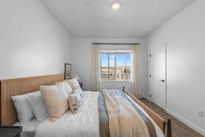 Carpeted bedroom with baseboards