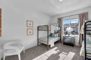 Bedroom with carpet floors and baseboards