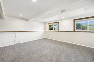 Empty room featuring carpet flooring and recessed lighting