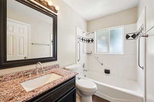 Full bath with vanity and shower / washtub combination