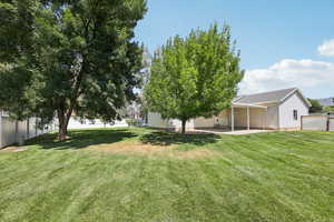 Fenced backyard with a patio area