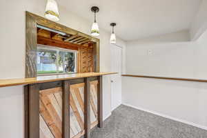 Stairs featuring carpet floors and baseboards