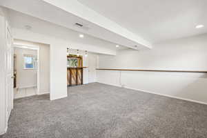 Carpeted empty room featuring recessed lighting and a textured ceiling