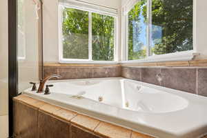 Full bath with a whirlpool tub
