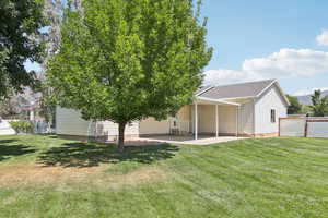 Back of property with a patio