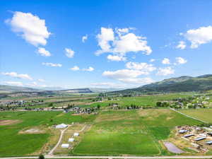 Aerial view of sparsely populated area with a mountainous background