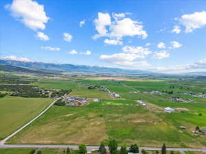 Overview of rural landscape featuring a mountainous background