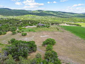 Aerial view of sparsely populated area featuring a mountain backdrop