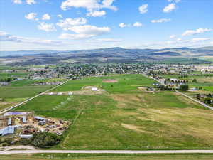 Aerial view of sparsely populated area featuring a mountain backdrop