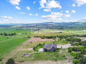 Overview of rural landscape featuring a mountainous background