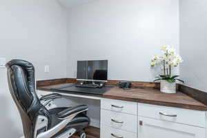 Home office featuring wood finished floors
