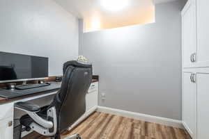 Office area with light wood finished floors and baseboards