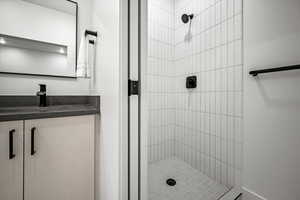 Full bathroom with a stall shower and vanity