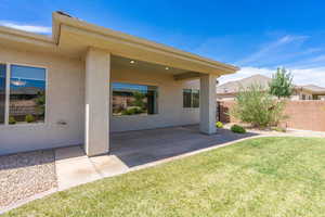 Rear view of house featuring a patio and stucco siding