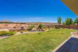 View of fenced backyard