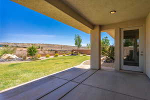 Fenced backyard featuring a patio