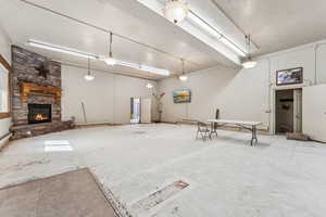 Garage with a fireplace