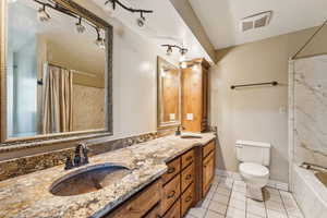 Full bathroom with tile patterned floors and double vanity
