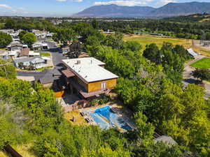 Drone / aerial view of a mountainous background and a pool