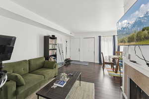 Living area with wood-type flooring and baseboards