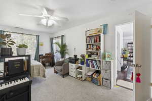 Bedroom featuring carpet floors and ceiling fan