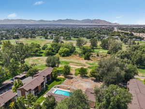 Bird's eye view of a mountain backdrop and a local golf course