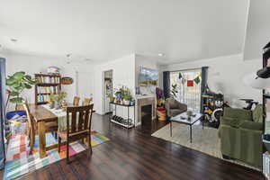 Living room featuring a fireplace, wood finished floors, and recessed lighting