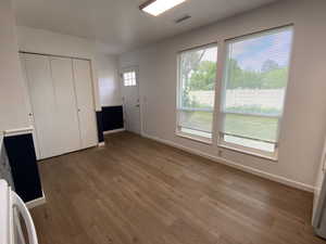 Unfurnished bedroom featuring light wood-style flooring and a closet