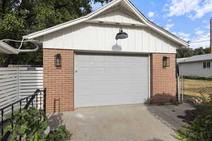 Detached garage featuring driveway