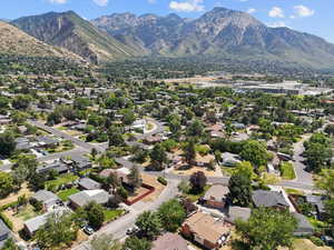 Aerial perspective of suburban area with a mountainous background
