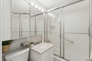 Full bath featuring toilet and vanity