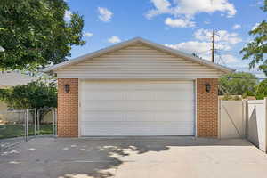 Detached garage featuring a gate