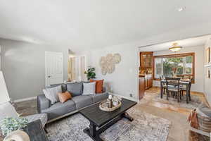 Living room featuring baseboards and light tile patterned flooring