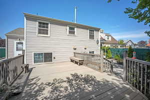 Back of property with a Trex deck. Benches