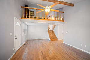 Library/Den overlook spacious living area.  Room for formal dining.