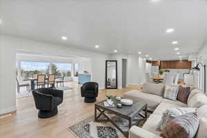 Living area featuring recessed lighting and light wood-style floors